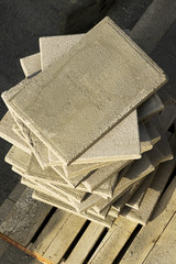 concrete floor tiles slabs for construction mason workers on wooden pallet