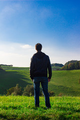 man deep breathing in nature