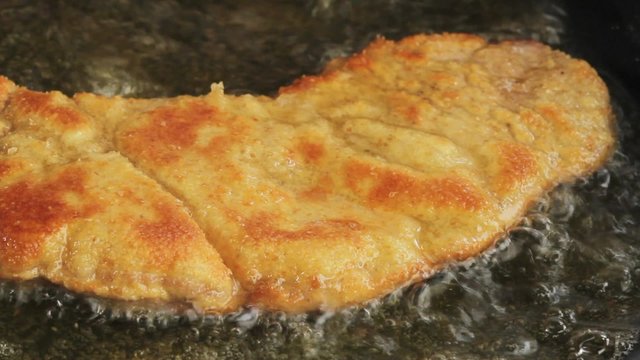 Frying Wiener Schnitzel in a pan
