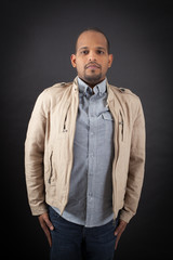 Handsome man doing different expressions in different sets of clothes: at attention