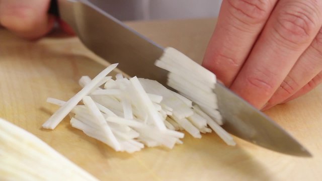 Celeriac being finely chopped