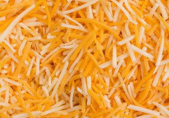 Close view of shredded cheeses