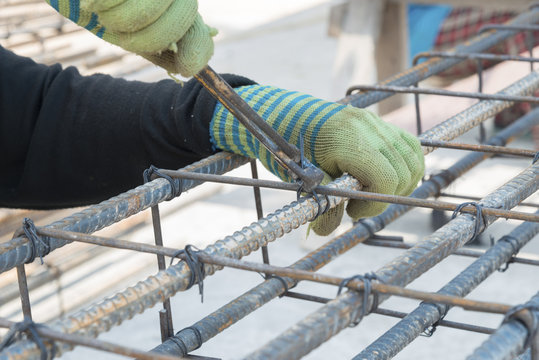 Construction workers are steel tie
