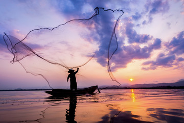 Fisherman of Bangpra Lake in action when fishing Thailand