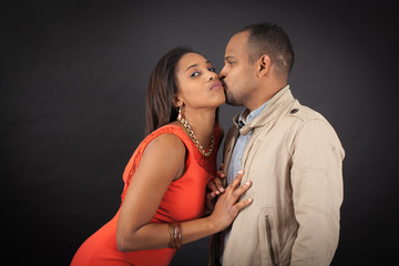 Handsome couple doing different expressions in different sets of clothes: kiss