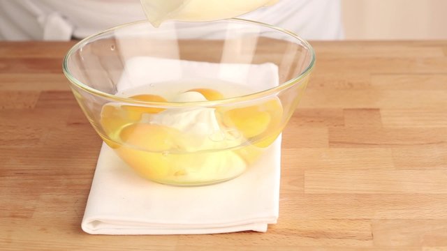 Creme fraiche being added to eggs