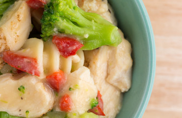 Grilled chicken and veggies in a small bowl
