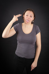 Fototapeta premium Beautiful woman doing different expressions in different sets of clothes: suicide