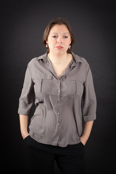 Beautiful woman doing different expressions in different sets of clothes: bored