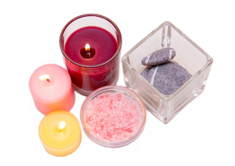 Candles and bath salts on white background seen from above