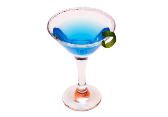 Blue cocktail with lime peel on white background