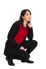 Beautiful woman doing different expressions in different sets of clothes: kneeling