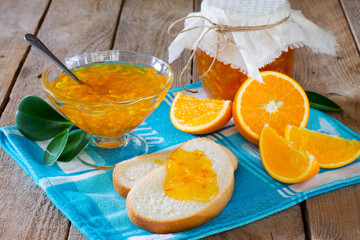 Fototapeta na wymiar Homemade orange marmalade on wooden table