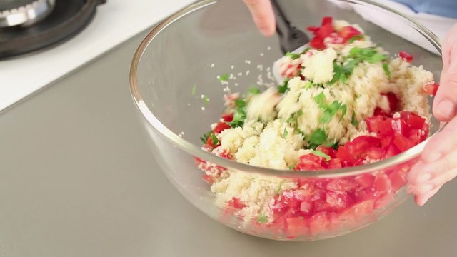 Ingredients for tabbouleh being mixed