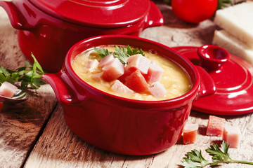 Pea soup with smoked meat, selective focus