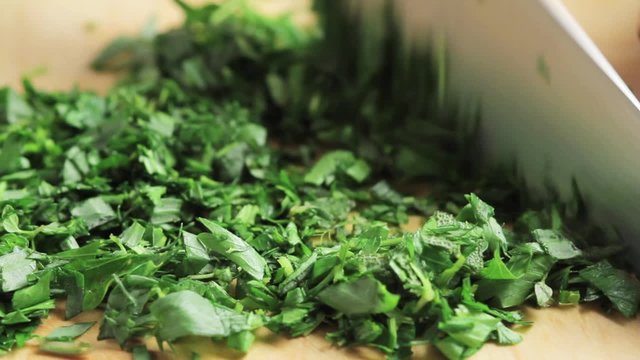 Fresh herbs being chopped