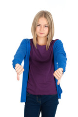 Fototapeta premium Beautiful girl doing different expressions in different sets of clothes: thumbs down