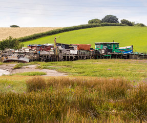 Skipool Creek, Thornton Cleveleys, Lancashire, UK. August 11th 2015. Old wooden boats at low tide at Skipool Creek, Lancashire, uk.