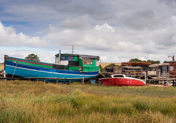 Fototapeta na wymiar Skipool Creek, Thornton Cleveleys, Lancashire, UK. August 11th 2015. Old Wooden boats at low tide at Skipool Creek, Lancashire, uk.