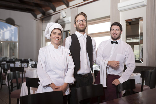 Restaurant employees receiving guests