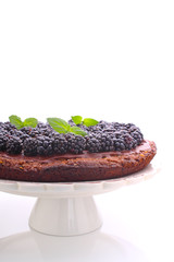 homemade chocolate cake with nuts and blackberry