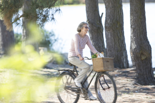 Senior woman riding on bicycle