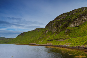 Lake and meadows in Skye island, Scotland