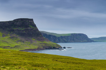 Fototapeta premium Mountains and ocean in Neist Point, isle of Skye, Scotland