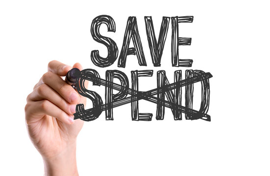 Hand With Marker Writing The Word Save Spend