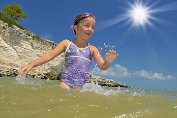 Kids playing in mediterannean sea