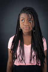 Beautiful girl doing different expressions in different sets of clothes: thinking