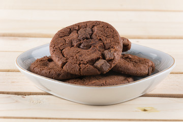 soft dark chocolate brownie cookies on wood
