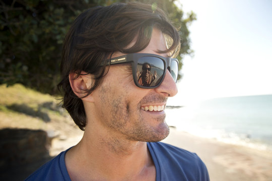 South Africa, portrait of smiling man wearing sunglasses