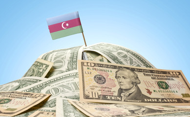 Flag of Azerbaijan sticking in a pile of american dollars.(serie