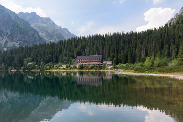 Fototapeta na wymiar Lake Popradske pleso with mountain hotel in High Tatras, Slovakia