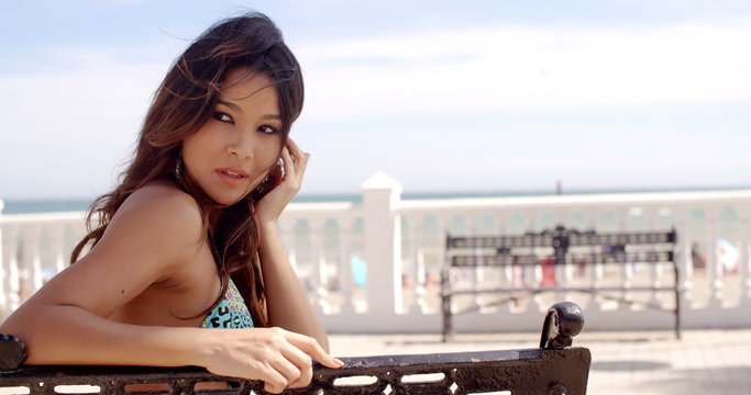 Pretty happy young woman relaxing at the seaside