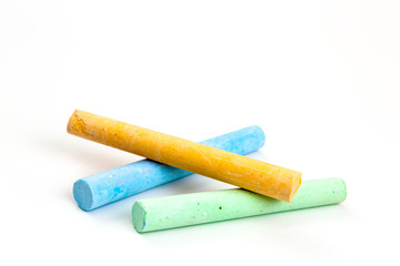 chalks in a variety of colors over white