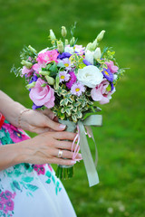 Fototapeta premium Bride holding beautiful wedding bouquet