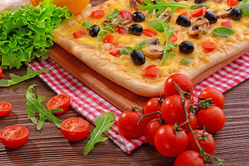 Delicious homemade pizza on table close-up