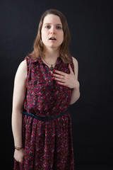 Beautiful woman doing different expressions in different sets of clothes: hearta attack