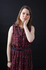 Beautiful woman doing different expressions in different sets of clothes: toothache