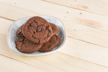 soft dark chocolate brownie cookies on wood