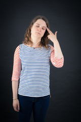 Fototapeta premium Beautiful woman doing different expressions in different sets of clothes: suicide