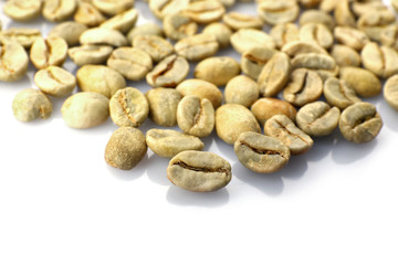 Heap of green coffee beans isolated on white