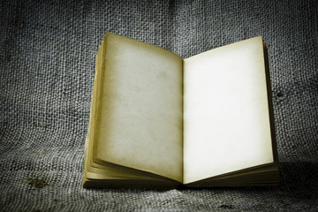 Stock Photo:.old book open blank pages, empty yellow paper on da