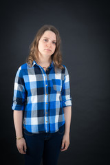 Beautiful woman doing different expressions in different sets of clothes: bored
