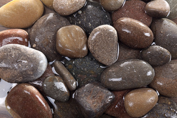 Fototapeta na wymiar Wet pebbles background