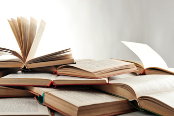 Many open books isolated on white