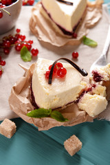 Tasty cheesecake with berries on table close up