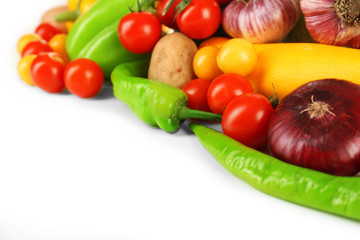 Heap of fresh vegetables isolated on white